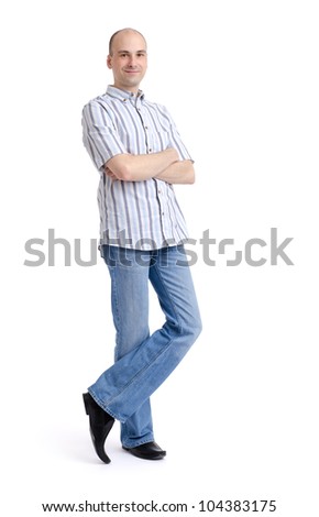 Full length portrait of a stylish young man standing isolated on white