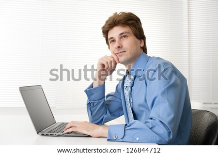 thinking business man with laptop