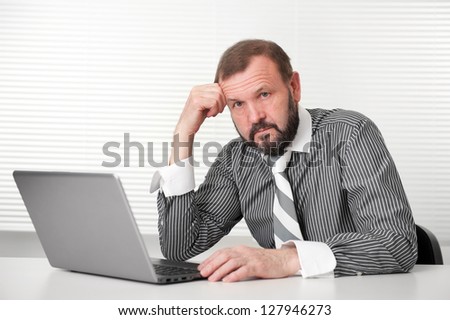Senior business man working on laptop