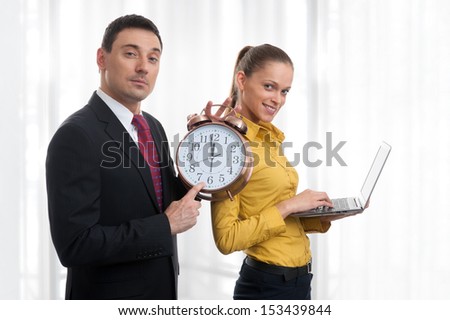 business people with laptop and alarm clock