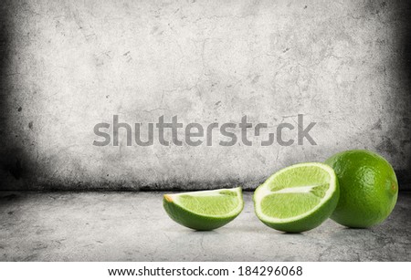 Fresh ripe lime on gray concrete floor
