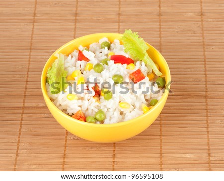 cooked rice in bowl with vegetables