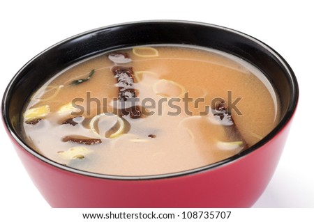 Soup. Miso soup. On a white background. Tofu, shiitake mushrooms, Wakame seaweed.