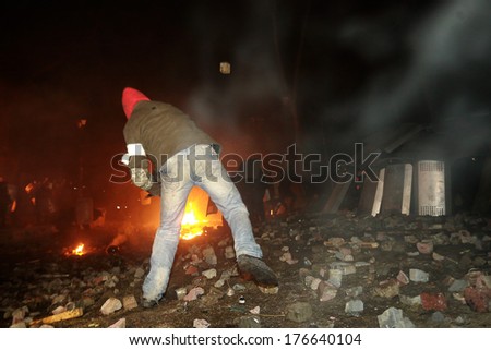 A Protester Throws Stones At Police. Kyiv, Ukraine, January 19, 2014