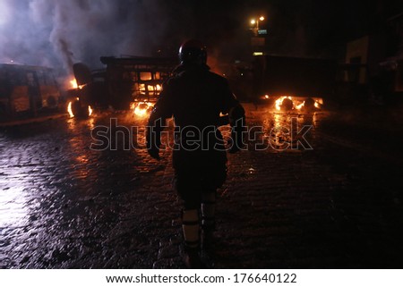 The Man On The Background Of Burning Police Buses. Kyiv, Ukraine, January 19, 2014