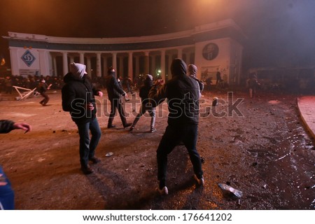 Protesters near the Dinamo stadium throwing stones at the police.  Kyiv, Ukraine, January 19, 2014