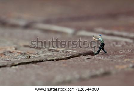 shallow depth of field image of miniature figures at work
