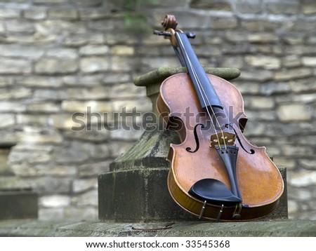 old broken violin on baroque area
