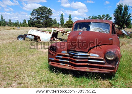 stock photo old and rust cars on a meadow