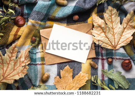 fall mockup card with autumn leaves invitation card with environment and details Mockup with postcard and flowers and ribbon on white background.