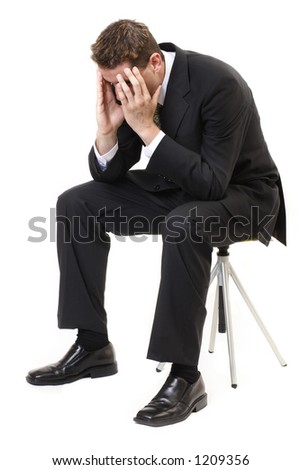 stock-photo-depressed-businessman-sitting-face-in-hands-1209356.jpg