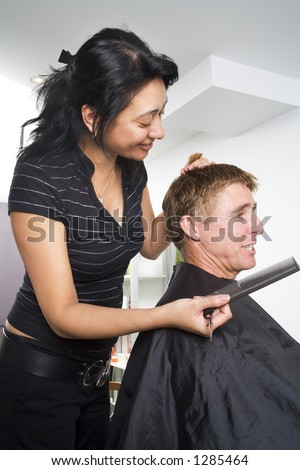 Man having his hair styled at the hair dressing salon