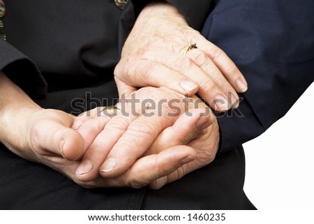 Old couple holding hands