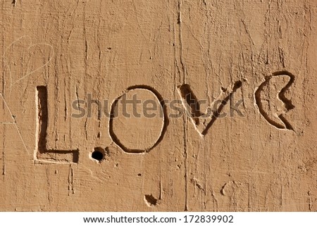 Love letters carved into a wall