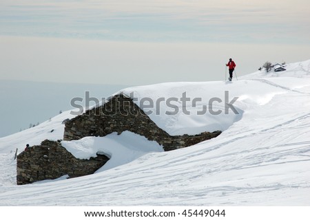 Hiking with snowshoes on a roof covered with snow, Mont Blanc.