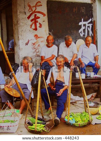Old men in a vegetable market in South China
