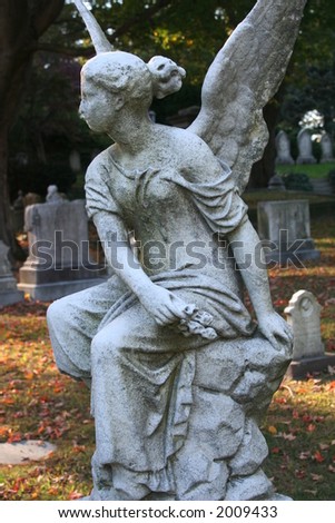 stock-photo-sitting-angel-statue-2009433.jpg