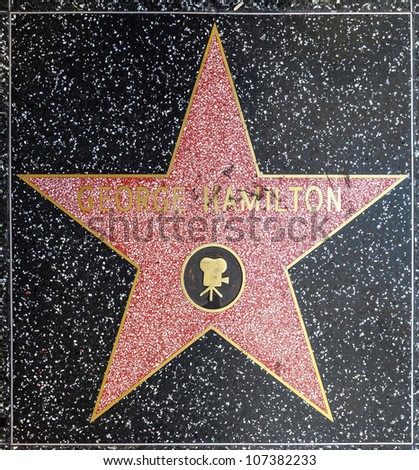 HOLLYWOOD - JUNE 26: George Hamilton\'s star on Hollywood Walk of Fame on June 26, 2012 in Hollywood, California. This star is located on Hollywood Blvd. and is one of 2400 celebrity stars.