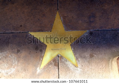 PHOENIX, USA - JUNE 14: star of  Spencer Tracy  in copper reflect the past glory of the Hotel San Carlos on June 14,2012 in Phoenix, USA. The stars in the sidewalk were put in due to their visits.
