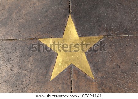 PHOENIX, USA - June 14: star of  Gene Autry in copper reflect the past glory of the Hotel San Carlos on June 14,2012 in Phoenix, USA. The stars in the sidewalk were put in in 1993due to their visits.