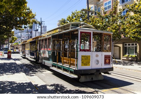 SAN FRANCISCO - JUNE 20: Famous Cable Car Bus near Fisherman\'s Wharf on June 20, 2012 in San Francisco, California. Cable car trains first began operating in the city in 1873.