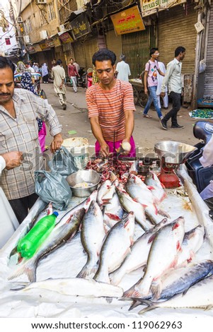NEW DELHI, INDIA - OCTOBER 17: Selling fish on fish market in New Delhi, India on  October,16 2012. Seafood is one of the main source of food for local people.