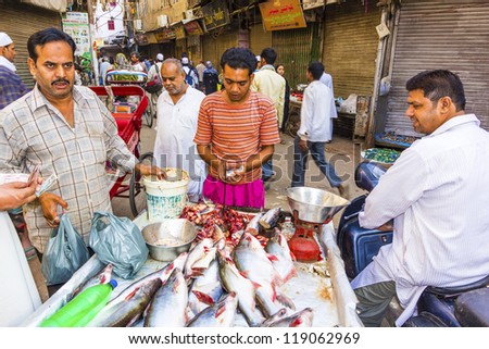 NEW DELHI, INDIA - OCTOBER 17: Selling fish on fish market in New Delhi, India on  October,16 2012. Seafood is one of the main source of food for local people.