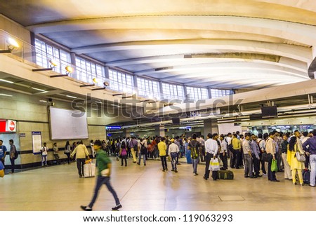 DELHI, INDIA - OCTOBER 16: passengers alighting metro train on October 16, 2012 in Delhi, India. Nearly 1 million passengers use the metro daily.
