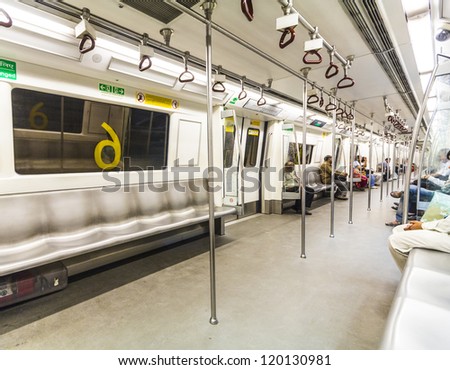 DELHI, INDIA - OCTOBER 16: passengers ride in the Modern metro yellow line on October 16, 2012 in Delhi, India. Nealy 1 million passengers use the metro daily.