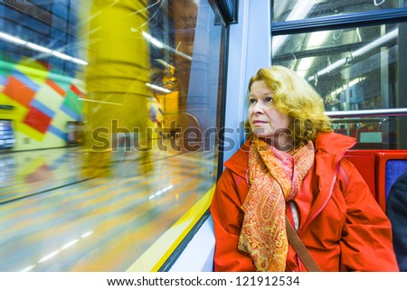 woman in subway by night