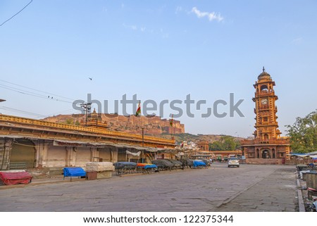 famous victorian clock tower in Jodhpur and view to fort, India