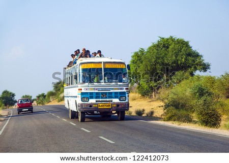 JODHPUR, INDIA - OCTOBER 23: people travel by bus in Jodhpur on October 23, 2012. Unsatisfactory quantity & quality of public transportation limit people in everyday traveling.