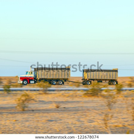GILA BEND, USA - JULY 11: truck on interstate 8 in early morning at July 11, 2012 in Gila Bend, USA. I-8 was part of the original 1957 plan of Interstates, following US 80 from San Diego to Gila Bend.