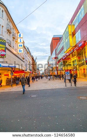 WIESBADEN, GERMANY - JAN 12: people shop in the pedestrian area on JAN 12,2013 in Wiesbaden, Germany. This central shopping zone offers a large variety of shops and stretches out for one kilometer..