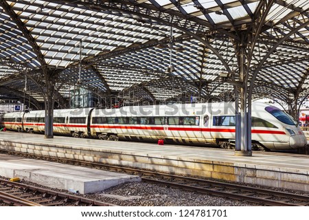 COLOGNE, GERMANY - MAY 28: train leaves the central railway station on May 28, 2011 in Cologne, Germany. An average about 280,000 travellers use this Station from 1857 daily.