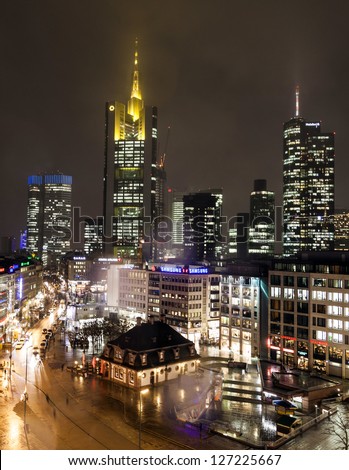 FRANKFURT, GERMANY - FEB 5: view to skyline with Hauptwache and skyscraper by night on February 5, 2013 in Frankfurt,Germany. It is the fifth-largest city in Germany with a 2012 population of 704,449.