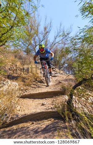 TUSCON, USA - JUNE 11: downhill bike rider in TUSCON, USA on June 11, 2012.  There are around 1,000 bicycle related deaths in the United States each year, 75% of which are due to head injuries.
