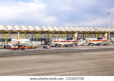 MADRID, SPAIN - APR 1: Aircraft park at Terminal 4 at Barajay Airport on April1, 2012 in Madrid, Spain. In 2010, over 49 million passengers used Madrid-Barajas making it the countrys largest airport.
