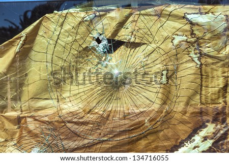 broken glass with cardboard to cover the hole
