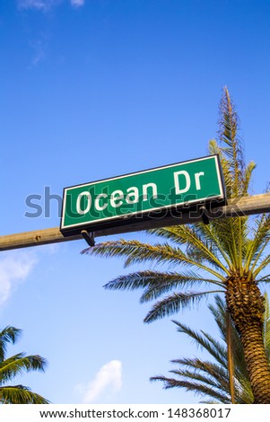 street sign of famous street Ocean Drive in Miami South with traffic light