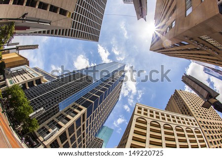 View To Modern Skyscraper In Downtown Houston Under Blue Sky