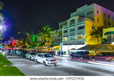 MIAMI BEACH - JULY 28: Night view at Ocean drive on July 28, 2013 in Miami Beach, Florida. Art Deco Night-Life in South Beach at Ocean Drive  is one of the main tourist attractions in Miami.