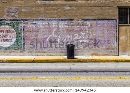 LAKE CHARLES, USA - AUGUST 9:   old painted advertising at the wall on August 9, 2013 in Lake Charles, USA. Painted ads on brick walls were common in the first alf of last century in america.