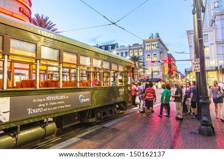 NEW ORLEANS - JULY 14: people travel with the famous old Street car St. Charles line on July 14, 2013 in New Orleans, USA.  It is the oldest continually operating street car line in the world.