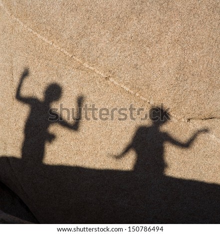shadow game of children with Scenic rocks  in Joshua tree national park, they play with shadow at the rock by using their arms and hands