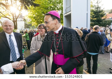 KONIGSTEIN, GERMANY - MAY 4: bishop Franz Peter Tebartz van Elst greets the parents of the confirmants on May 4, 2013 in Konigstein, Germany. Confirmation is the step to became a full church member.