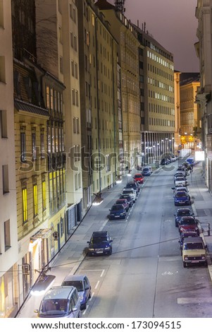 VIENNA, AUSTRIA - NOV 25: Vienna - famous narrow street in first district at night with cars parking  and lights of windows and houses on November 25, 2009 in Vienna, Austria.