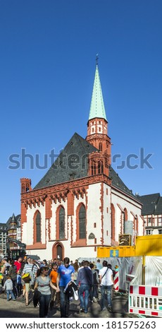 FRANKFURT, GERMANY - MARCH 25: People on Roemerberg square on March 25, 2012 in Frankfurt, Germany. Frankfurt is the fifth-largest city in Germany, with a population of 687,775.