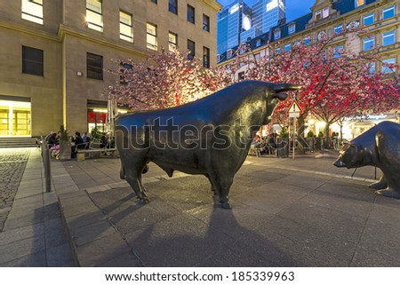 FRANKFURT - APRIL 4: Illuminated stock exchange with bull and bear at night on April 4, 2014 in Frankfurt, Germany. This festival Luminale takes place in Frankfurt every 2 years and lasts one week.