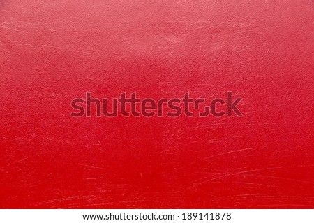 red metal background painted in red with scratches
